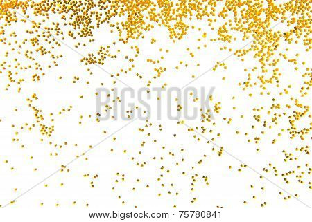 golden glitter falling isolated on white