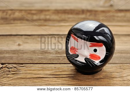 Yokai - Japanese One-eye Demon On Wooden Background