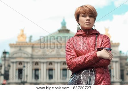 blonde woman portrait in front of Opera theater Paris, France.