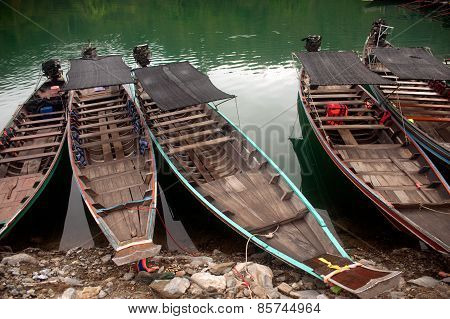 Traditional Boat Waiting Torists In Cheow Larn Lake,Thailand.