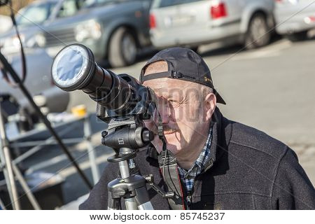 People Watch The Partial Eclipse At The Feldberg
