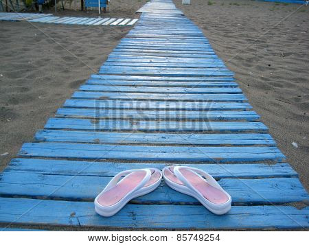Flip-flops On The Beach.