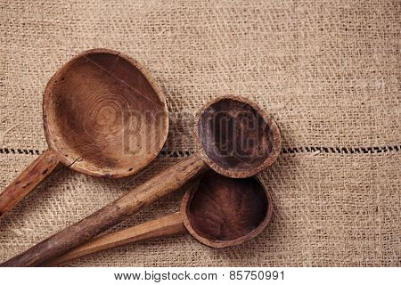 real vintage wooden spoons on old grain sacking linen Completely hand made  handwoven and homespun