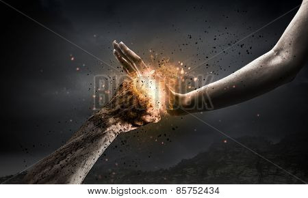One hand preventing punch attack of another hand