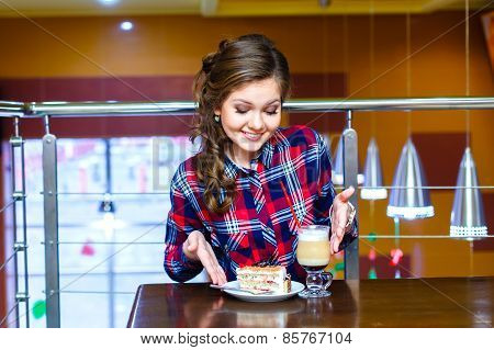 Young Beautiful Women Shows To Cup Of Mokachino And Cake
