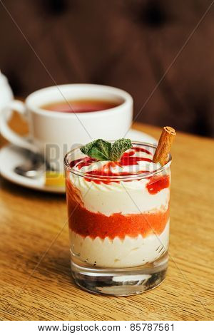 Tea With White Mousse With Milk Cream