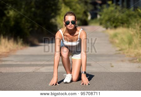 Young Woman Runner Outdoor Standing In Start Pose