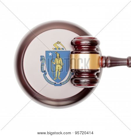 Wooden judge gavel with US state flag on sound block - Massachusetts