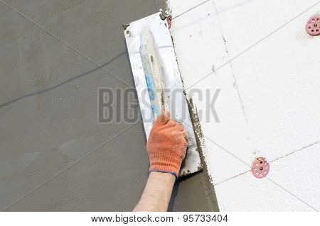 The Process Of Applying Putty With A Spatula