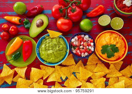 Mexican food nachos guacamole pico de gallo and dipping cheddar cheese