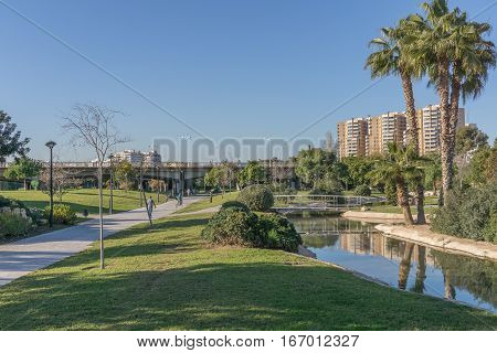 Turia River gardens Jardin del Turia, leisure and sport area. Pedestrian walk way and artificial water channel. Valencia, Spain