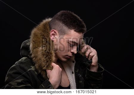 Young Man Posing Jacket, Looking Down Sideways