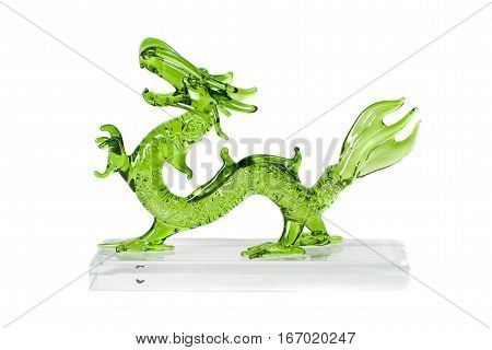 Glass green traditional chinese dragon isolated on white background. Feng Shui statuette.