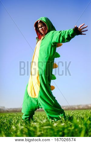Dragon kigurumi on the green fild, girl