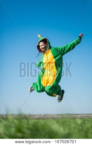 Dragon kigurumi on the green fild, girl