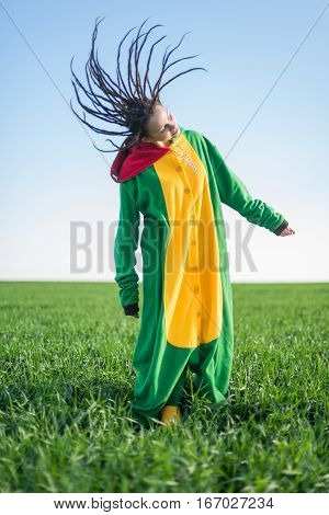 Dragon kigurumi on the green fild, girl