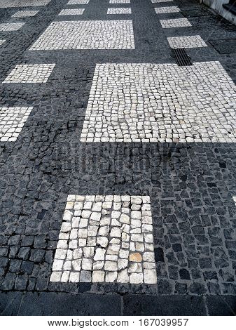 Typical Portuguese black and white stone mosaic 