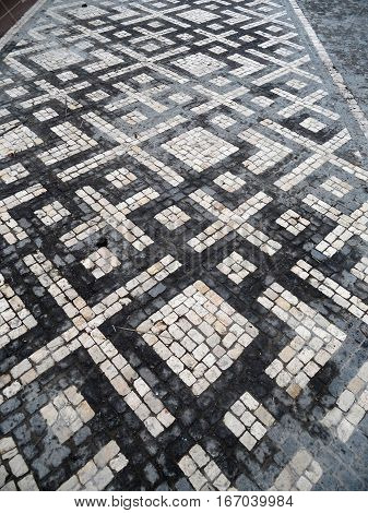 Typical Portuguese black and white stone mosaic 