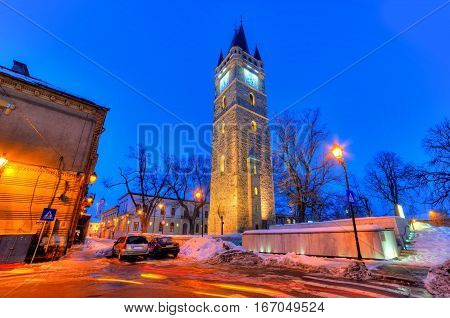 Traditional architecture of the famous tower of Iancu de Hunedoara, illuminated at night - Baia Mare - Romania