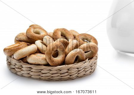 Whole bagels in a wicker basket. Sweet bread. isolated