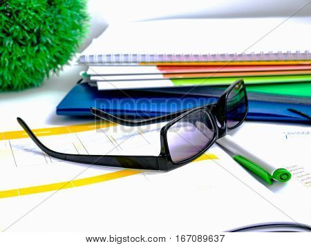 Financial report, analysis, graphs and tables on the working table