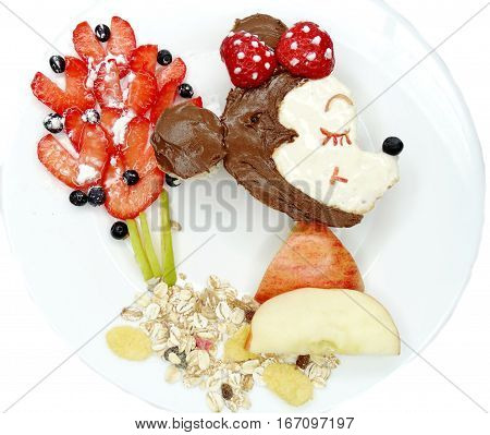 creative breakfast food with fruit and chocolate sweet cream on bread