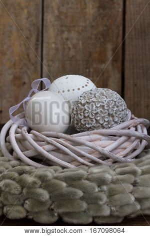 Easter eggs hunt - eggs nest on wooden background