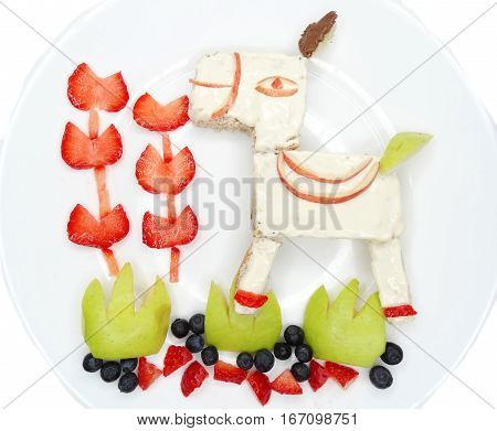 creative breakfast food with fruit and chocolate sweet cream on bread
