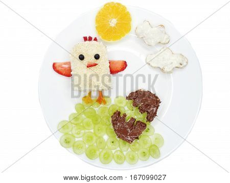creative breakfast food with fruit and chocolate sweet cream on bread
