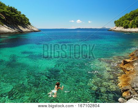 Amazing view of woman swimming in the sea