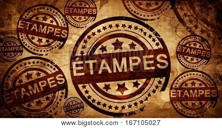 etampes, vintage stamp on paper background