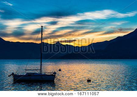 Lake Como at sunset with boat at varenna, Italy