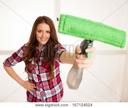 Happy Young Woman Cleaning Windows Isolated Over White Vackground