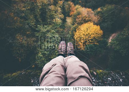 Feet selfie on cliff with forest aerial view Travel Lifestyle adventure vacations concept into the wild