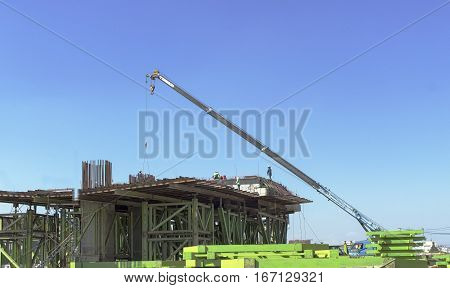 crane move material at bridge construction site