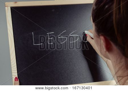Lesson Written In White Chalk On A Black Chalkboard