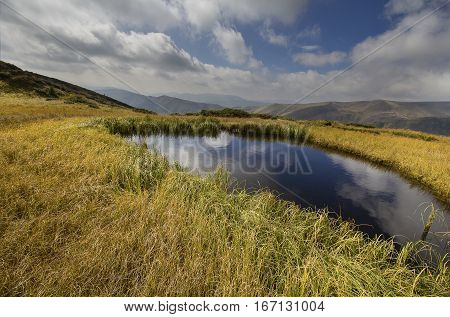 Clear lke clouds and Svydovets ridge. Carpathians
