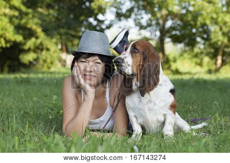 The woman with a dog in the park Selective focus and small depth of field lens flare