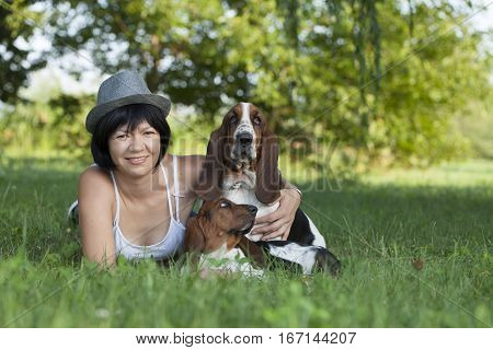 The woman with the dogs in the countryside Selective focus and small depth of field lens flare