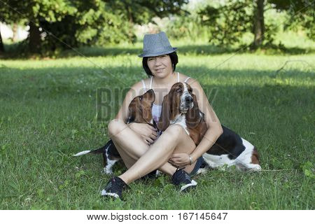 The woman with the dogs in the countryside Selective focus and small depth of field lens flare