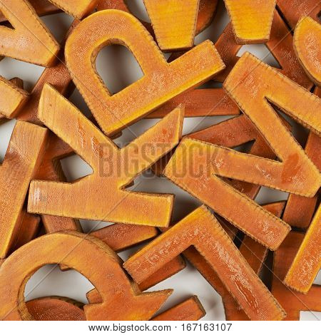 Surface coated with the multiple painted wooden block letters as an abstract backrop composition