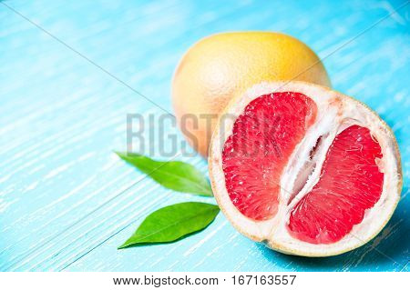 Grapefruit Fruits On A Blue Wooden Table