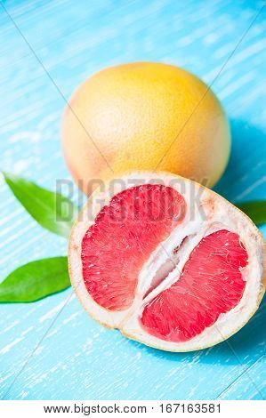 Grapefruit Fruits On A Blue Wooden Table
