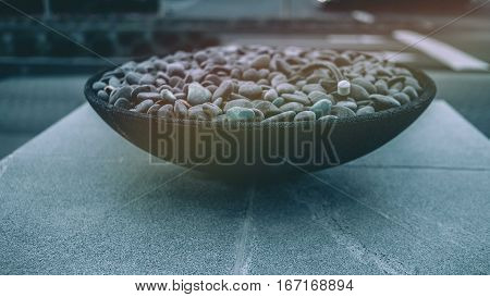Bowl of stones on Cement block, zen concept