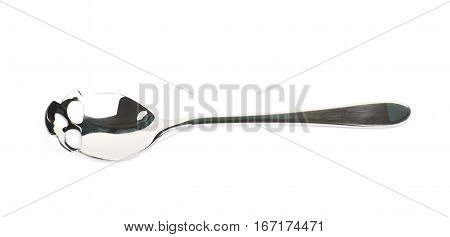 Skull shaped silver teaspoon isolated over the white background
