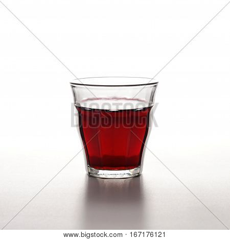 still life of a glass full of red wine Barbera