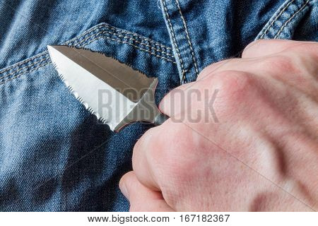 Neck Knife In Hand. Closeup.