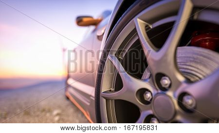 Close-up photos wheel sport. The scene behind as the sun going down with wind turbines in the back.