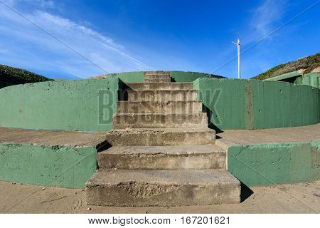 A gun battery steps next to Baker Beach near the Golden Gate Bridge