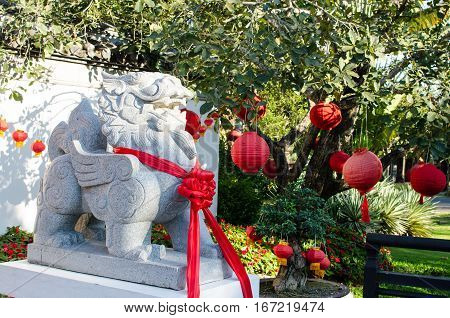 Ancient Chinese Lion Stone with Red Bow mean Power and Storng